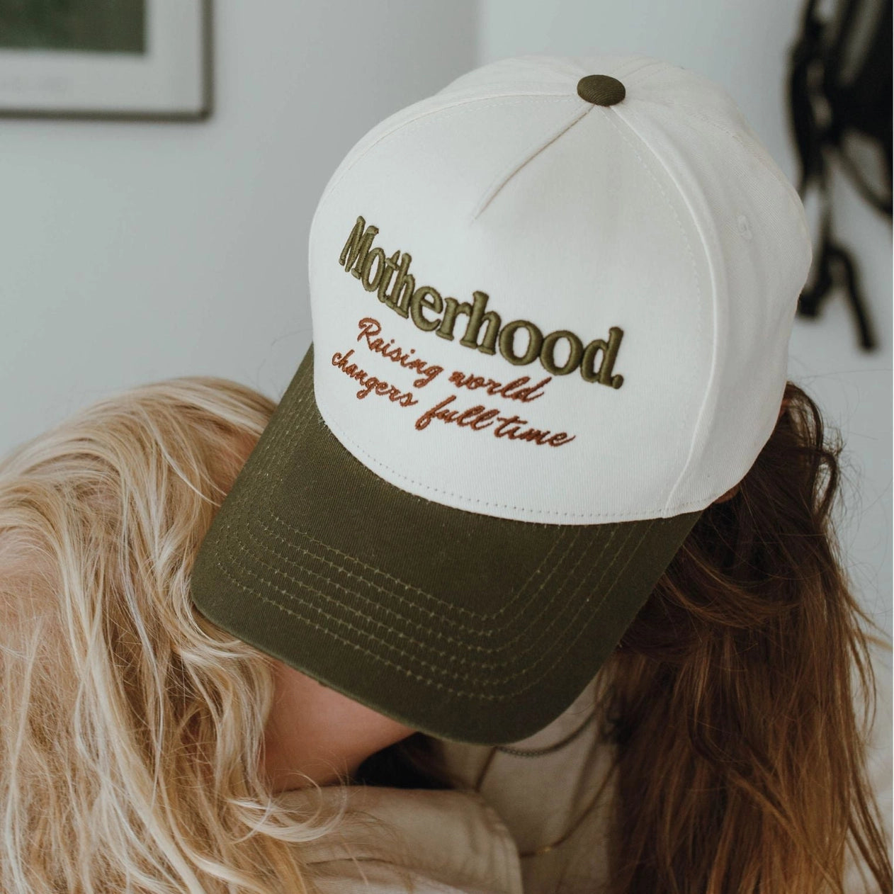 Motherhood: Raising World Changer Trucker Hat